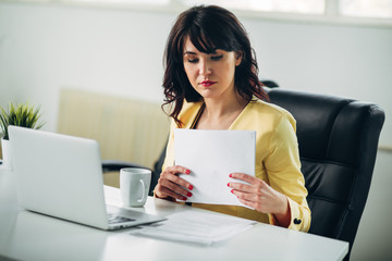 Young woman in office working
