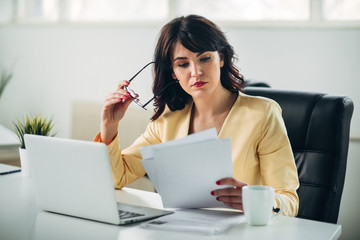 Young woman in office working