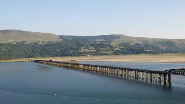 The rail and footbridge over the Mawddach estuary Barmouth Gwynedd North Wales