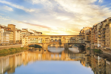 Beautiful view of the Ponte Vecchio bridge across the Arno River in Florence, Italy