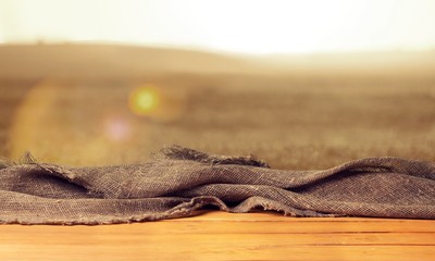 Worn table and blur with bokeh grass background