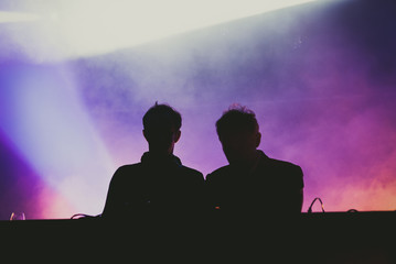 Silhouette of unregnizables deejays