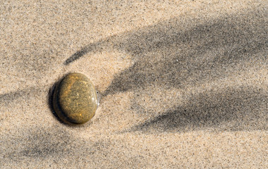 Rock on beach after tide out