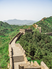 The Great Wall Jinshanling section with green trees in a sunny day, Beijing, China