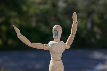 Wooden art mannequin closeup summer sunshine, np people.