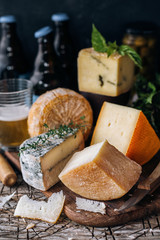 Several types of cheese and beer
