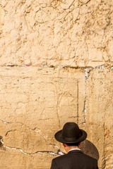 Orthodox jewish man prays at the Wailing Wall. An Important Jewish religious site located in the...