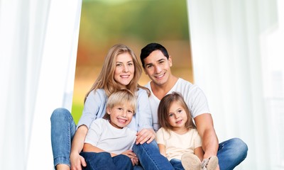 Fototapeta na wymiar Beautiful smiling family on background
