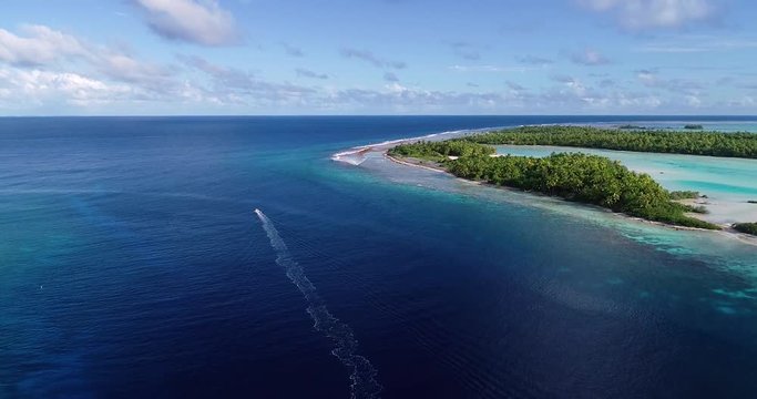 boat in a lagoon in French Polynesia, in aerial view
