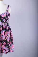 Tailors Mannequin dressed in a Black and Pink Floral Dress