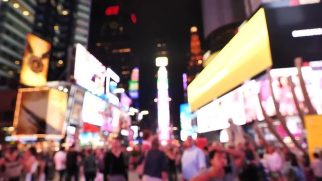 Crowd of people Times Square At Night out of focus New York City