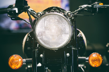 Close-up view of motorcycle headlight. Vintage classic Motorcycle headlight or head lamp. - Powered by Adobe
