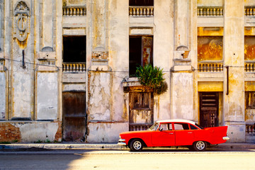 Urban decay and classic car in Old Havana