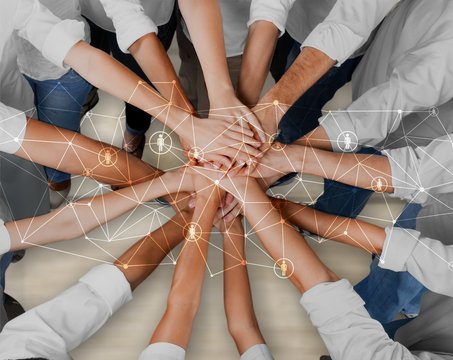 Top View of People in Circle with Their Hands Together