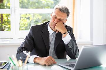 Businessman Sleeping In Office