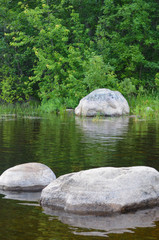 Naklejka na ściany i meble Minnesota north woods rocks in water