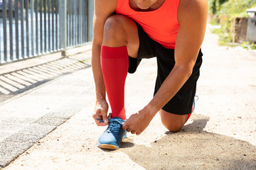 Male Athlete Tying Shoelace