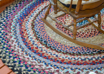 Antique vintage braided rug and rocking chair ready for text