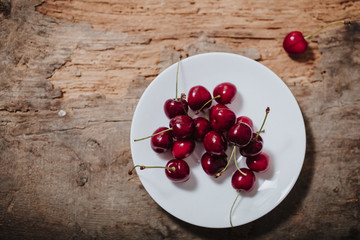 juicy and ripe cherry on a plate