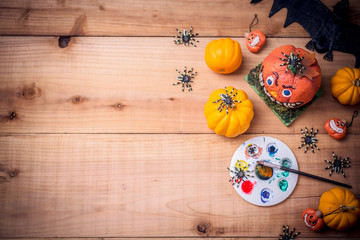 Happy Halloween. Werewolf or zombie hands painting scary pumpkin for trick or treat party. copy...