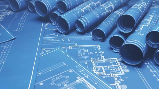 Stack of classic architectural blueprint rolls. Drawings of project plans. 4KHD
