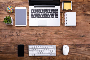 Overhead View Of Office Supplies And Gadgets
