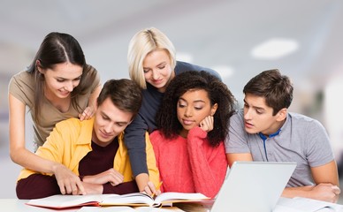 Four Young students studying subject on background