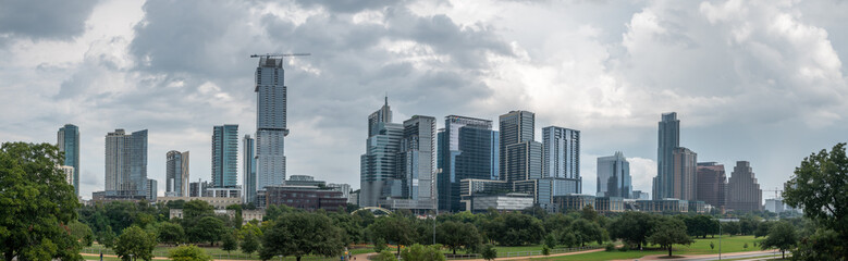 Fototapeta na wymiar Austin Skyline from Large Park With Storm Clouds