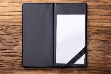 Blank Empty White Paper In Black Leather Folder