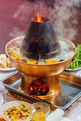Asian traditional double flavor hot pot close-up