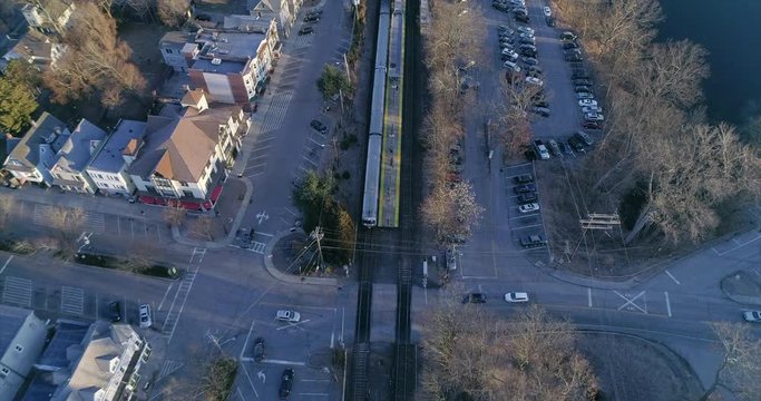 Top View Tilt Down of a Street Intersection and Train Tracks 