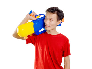 Young man with water gun toy Thailand Songkran Festival. Asian one person wear red short sleeves. isolated.