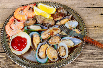 Seafood of green mussels shrimp lemon sea gourmet dinner lunch raw appetizer shell