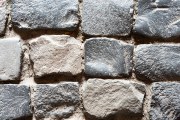 Gray paving stones as background, top view