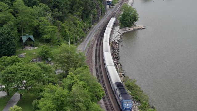 Flying Over Passing Train by the Hudson River
