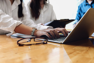 Business financial, Business accountant using laptop and discussing with partner are meeting to audit finance planning sales to meet targets set in next year. budget plan concept.