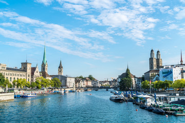 Fototapeta na wymiar Zurich city center with famous Fraumunster and Grossmunster Churches and river Limmat