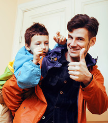 young handsome father with his son fooling around at home, lifes