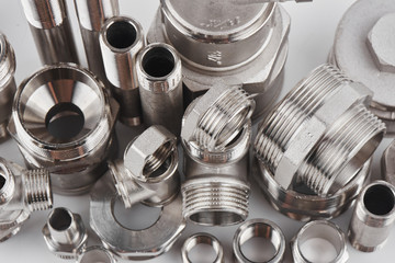 Concept of plumbing tools and accessories on a white background.