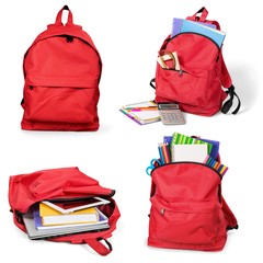 Open red school backpacks isolated