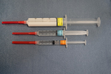Three Labeled Anesthesia Drugs, Propofol, Fentanyl and Midazolam, on a Blue Towel