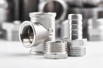 Concept of plumbing tools and accessories on a white background.