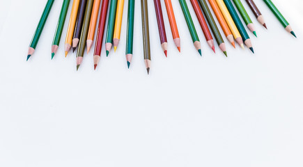 Set of colorful pencils on white background. Autumn color palette Back to school concept. Copy...