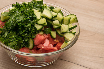 Sliced cucumbers and tomatoes. Ingredients for salad preparation.