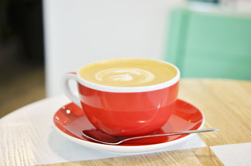 Сup of coffee on table in coffee shop cafe.