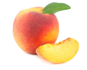 peach fruit with green leaf and slices isolated on white background