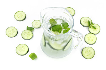 Cucumber and mint lemonade in a jar on a white background with copyspace
