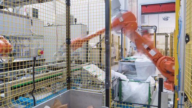 Industrial robotic arms at work. 4K Time-lapse