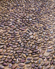 Overhead view of cobblestone street texture.