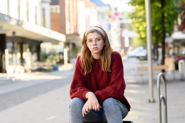 Fototapeta premium Young girl student with urban background